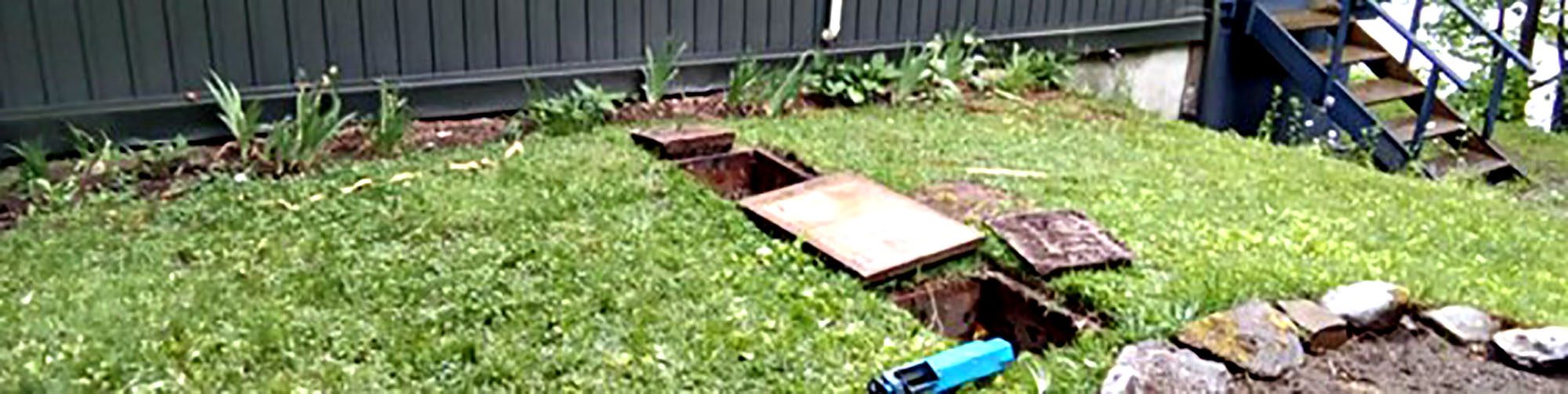 Sump pump installation trench in a residential lawn