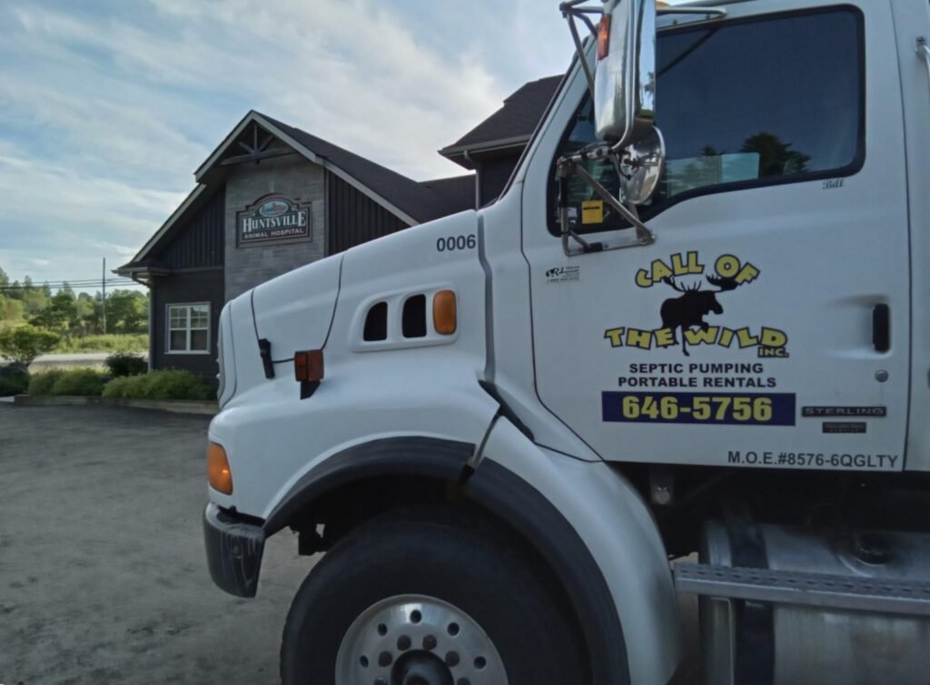 Septic service truck at Huntsville building site