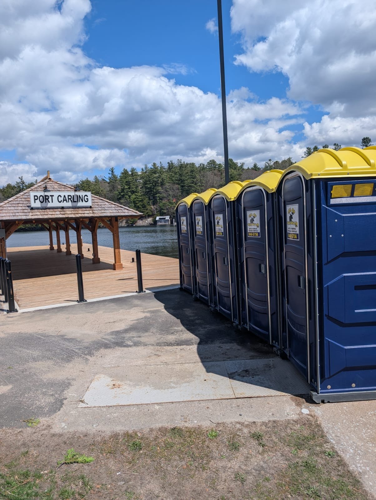 Portable toilets at Port Carling waterfront on a sunny day